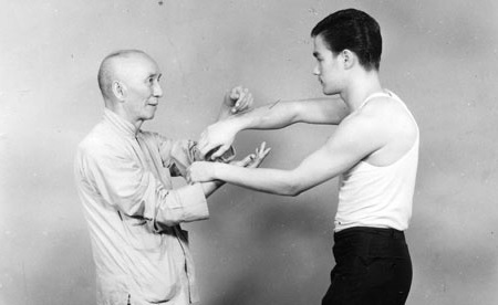 An 18 year old Bruce Lee practising Chi Sau or sticking hands with his Sifu, Ip Man