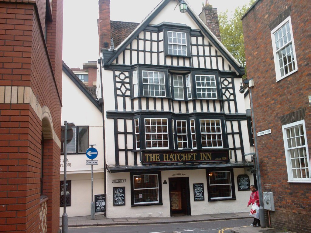 The black and white timbered pub called the Hatchett Inn. It is so old that the building is sloping