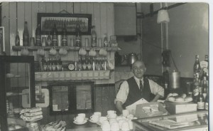 A black and white photograph of a cafe in the early 1950s