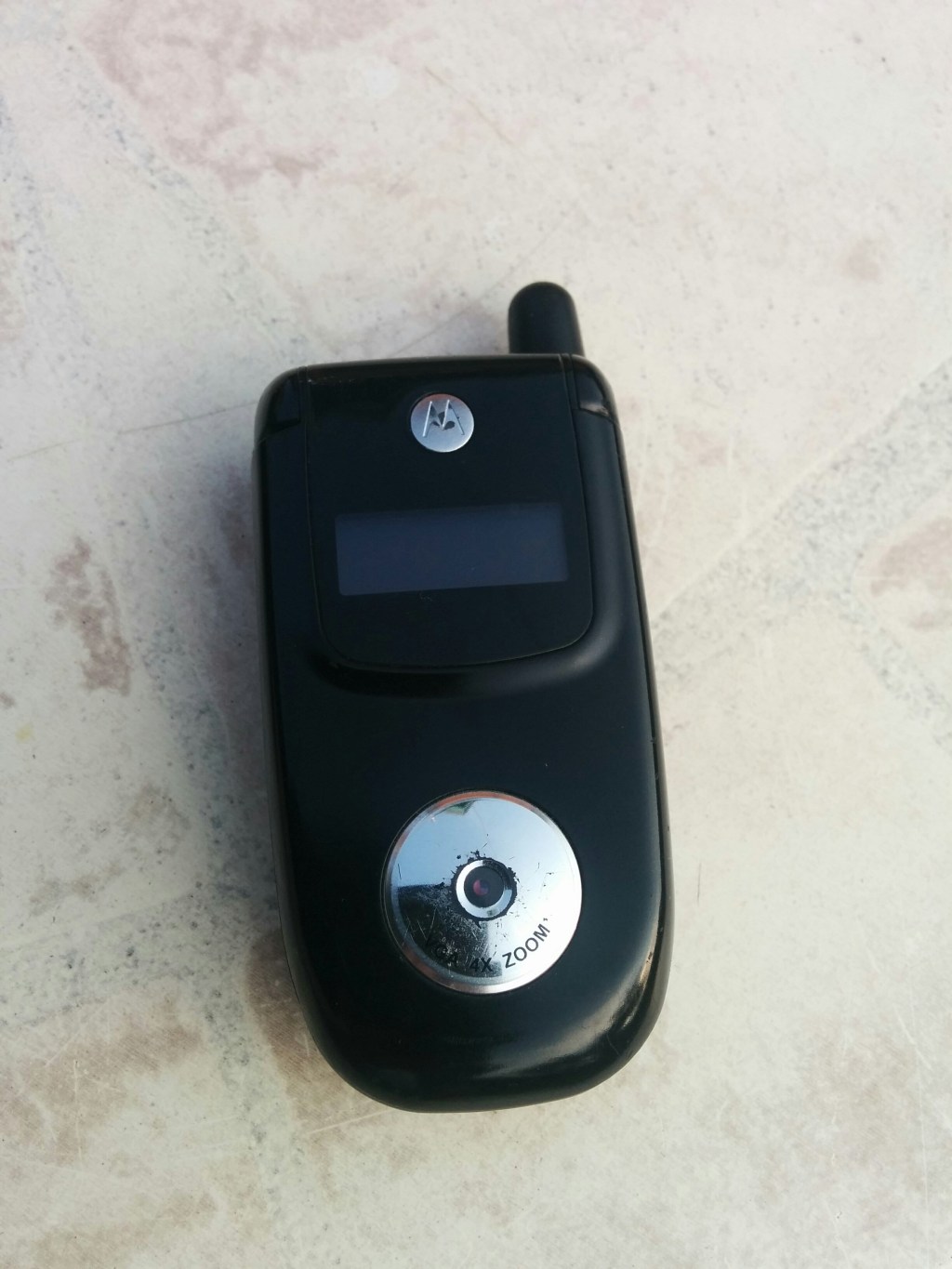 A black Motorola V220 mobile phone