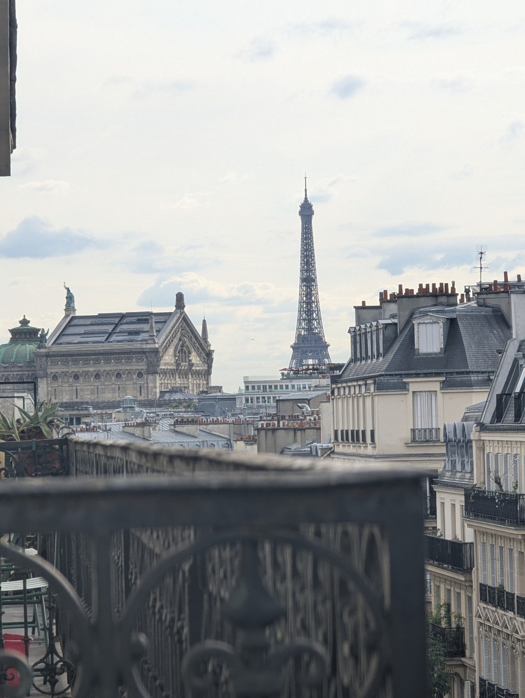 A view from a balcony of the Eiffel Tower and Opera Garnier in Paris